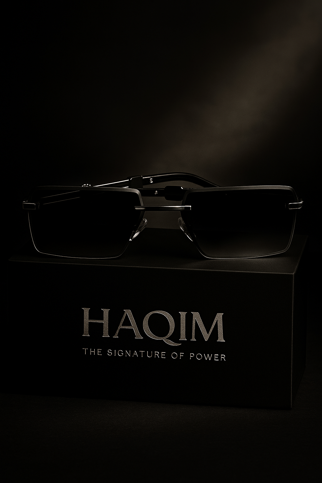 Sunglasses on a black box with 'HAQIM' branding against a dark background