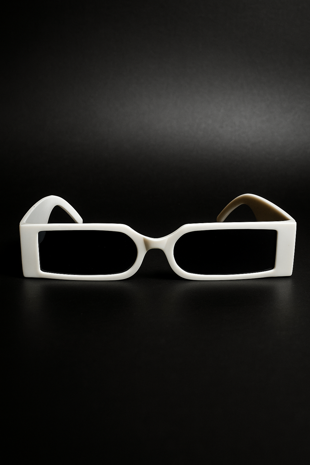 White sunglasses on a black background