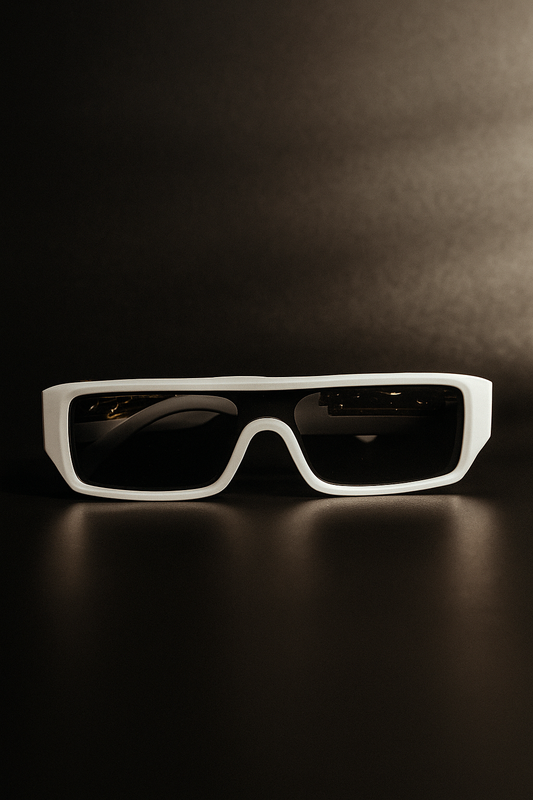 White sunglasses with black lenses on a dark background